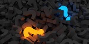 Blue and Orange Light up Question marks in dark pile