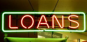 loan sign illuminates the consequences of refinancing or consolidation on credit scores